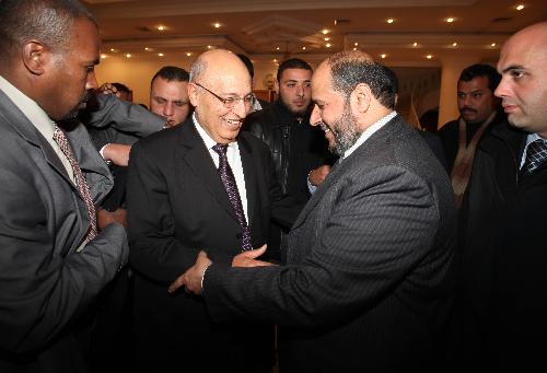 Nabil Shaath (2nd L), member of Fatah Central Committee, shakes hands with senior Hamas leader Khalil al-Hayya (2nd R) following their meeting in Gaza City, Feb. 3, 2010. [Wissam Nassar/Xinhua] 