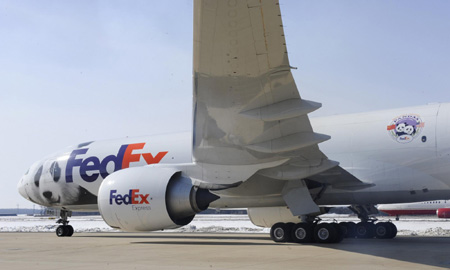 The plane carrying giant pandas Mei Lan of Atlanta, and Tai Shan of Washington, taxis for departure for a trip to China, Thursday, Feb. 4, 2010, at Dulles International Airport in Chantilly, Virginia. [Xinhua] 