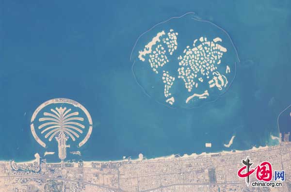 This image provided by nasa shows man-made archipelagos near dubai, united arab emirates in this image photographed by an expedition 22 crew member on the international space station jan. 13, 2010.