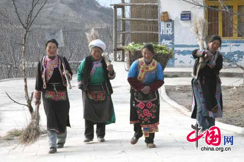 Qiang women doing housework in Luobo Village.