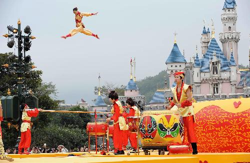 Acrobats perform to celebrate the upcoming Spring Festival at Disneyland in south China's Hong Kong Feb. 4, 2010. This Spring Festival, the Chinese New Year by the lunar calendar, falls on Feb. 14. 2010.