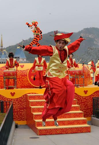  A dancer performs to celebrate the upcoming Spring Festival at Disneyland in south China's Hong Kong Feb. 4, 2010. This Spring Festival, the Chinese New Year by the lunar calendar, falls on Feb. 14. 2010. 