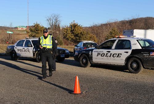 A policeman stands on duty near the blast site at the Kleen Energy plant in Middletown, Connecticut, the United States, Feb. 7, 2010. [Xinhua]