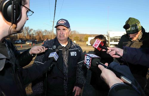 Al Santostefano, deputy fire marshal in Middletown, briefs the media about the blast at the Kleen Energy plant in Middletown, Connecticut, the United States, Feb. 7, 2010. [Xinhua]