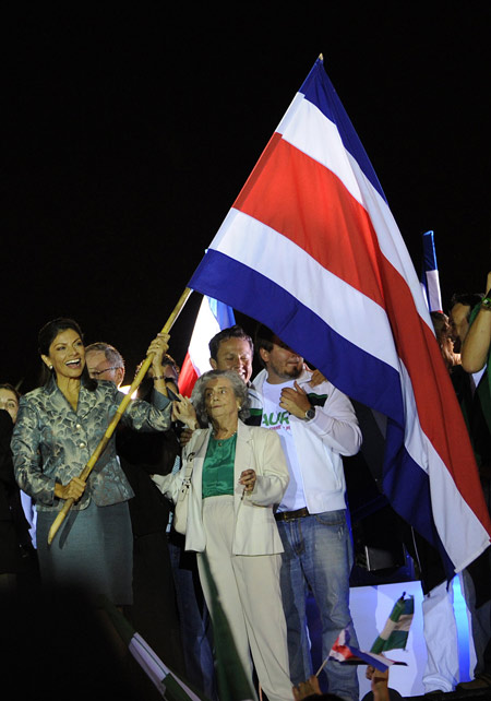 Ruling party candidate Laura Chinchilla (R) gestures to her supporters as she celebrates her victory in San Jose, Costa Rica, Feb. 7, 2010. [Xinhua/Esteban Dato]