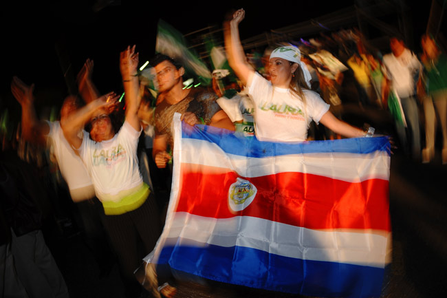 Supporters of ruling party candidate Laura Chinchilla celebrate in San Jose, Costa Rica, Feb. 7, 2010. Ruling party candidate Laura Chinchilla declared victory Sunday night in Costa Rica&apos;s Feb. 7 presidential election, after her main rivals, Otton Solis and Otto Guevara, had conceded defeat and congratulated her as the country&apos;s first female president in history. [Xinhua/Esteban Dato]