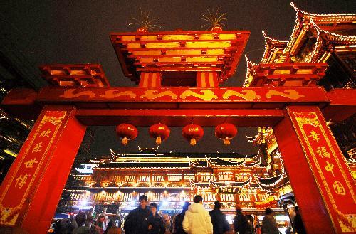 The colorful lanterns of China Pavilion and the festooned lanterns in the Yuyuan Garden are seen during the trial illumination of the 2010 Shanghai Yuyuan Garden New Spring Folklore Artistic Lanterns Fair, in downtown Shanghai, east China, February 7, 2010.