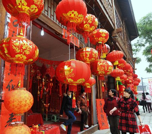 People select red lanterns for New Year decoration at a New Year shopping mall in Fuzhou, capital of southeast China's Fujian Province, Feb. 8, 2010. Chinese people are preparing to celebrate the traditional Chinese New Year, or the Spring Festival, which falls on Feb. 14 this year. (Xinhua