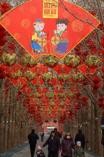 Red lanterns are hung at Ditan Park in Beijing, China, Feb. 9, 2010. Red lanterns are seen in many parks in Beijing as the traditional Chinese new year approaches. (Xinhua