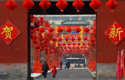 Red lanterns are hung at Ditan Park in Beijing, China, Feb. 9, 2010. Red lanterns are seen in many parks in Beijing as the traditional Chinese new year approaches. (Xinhua/
