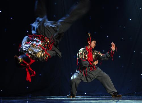 Actors from the Art Troupe of the High School Affiliated to Renmin University (RDFZ) of China perform Chinese Kongfu 'Emperor Qin's Soldiers' in Wellington College, Crowthorne of Berkshire, Britain, Feb. 8, 2010.