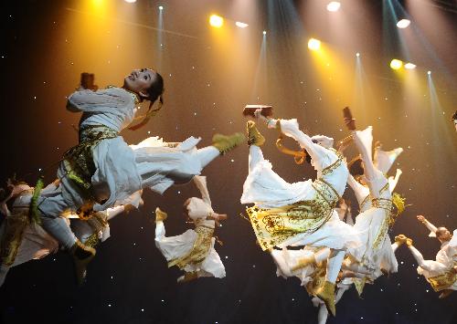 Dancers from the Art Troupe of the High School Affiliated to Renmin University (RDFZ) of China perform 'Youth Ambition' in Wellington College, Crowthorne of Berkshire, Britain, Feb. 8, 2010.