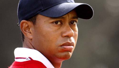 U.S. team member Tiger Woods watches play as he stands on the sixth hole during his foursome match at the Presidents Cup golf tournament at Harding Park golf course in San Francisco, California, in this October 8, 2009 file photo.(Xinhua/Reuters File Photo)