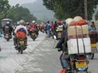 100,000 migrant workers go home by motorcycle in S China