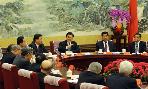 Chinese President Hu Jintao (3rd R), who is also General Secretary of the Communist Party of China (CPC) Central Committee and chairman of the Central Military Commission (CMC), speaks during a meeting with representatives of non-communist parties ahead of the Spring Festival in Beijing, capital of China, Feb. 10, 2010. 
