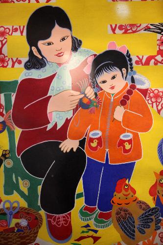 The photo taken on Feb. 10, 2010 shows a picture displayed on an exhibition of farmers' paintings held in Xuchang City of central China's Henan Province. A big number of pictures painted with simple and magnificent styles by local farmers of central China were showed on the exhibition to greet the coming Spring Festival. 