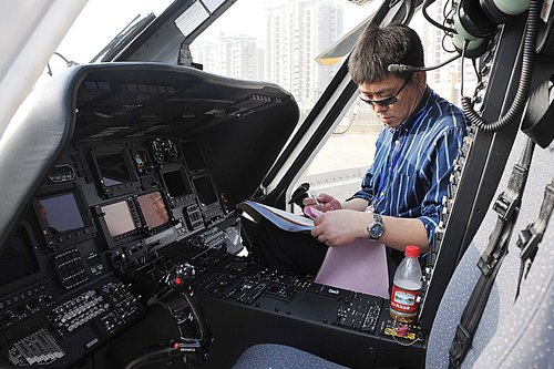 Zou Jianming lands his rented helicopter on a square in Fuzhou, capital of Fujian province after a three-hour flight from Shanghai on February 9, 2010. Fuzhou is just Zou's first stop and he plans to stay in several different cities during the Spring Festival to meet friends and relatives. The trip is expected to cost 3 million yuan ($439,200). 