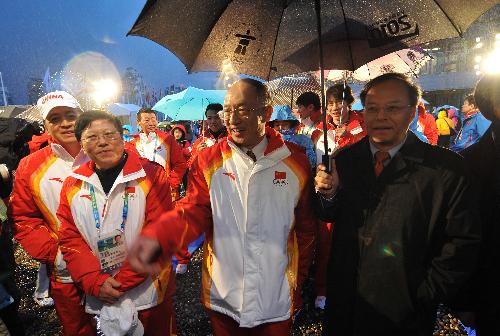 Liu Peng (front C), chef de mission of the Chinese delegation, and Lan Lijun (1st R), Chinese ambassador to Canada, attend the flag-raising ceremony to the Vancouver 2010 Winter Olympic Games in Vancouver, Feb. 10, 2010. 