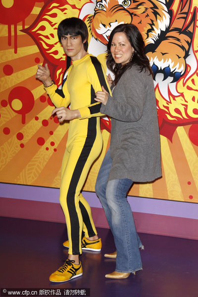 Lee's daughter Shannon Lee with the wax figure