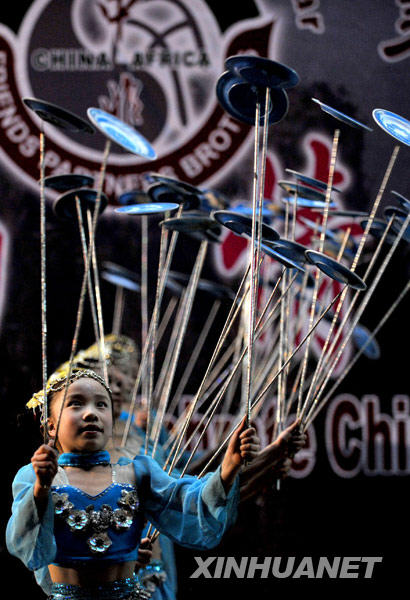Acrobats from central China's Hunan Province give a performance in Nairobi, capital of Kenya, February 10, 2010. More than 20 actors staged an art performance here on Wednesday. As part of the presentation of Chinese culture during the Chinese Spring Festival, the troupe will also visit Tanzania and Lesotho.