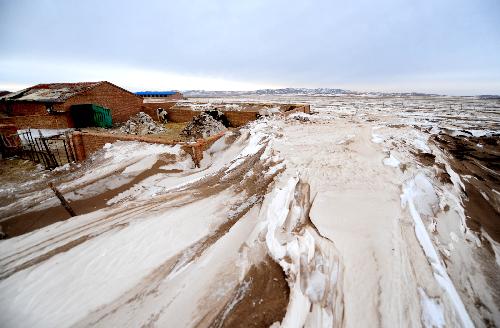 A livestock shed is surrounded in Xilingol League of north China's Inner Mongolia Autonomous Region, Feb. 10, 2010.