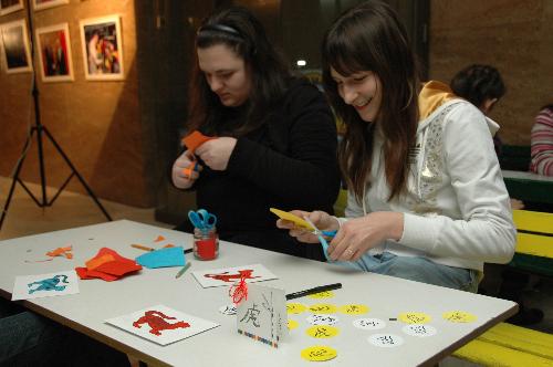 Bulgarian children make paper-cut at the art salon 'Two Cultures, One World' in Sofia, capital of Bulgaria, Feb. 11, 2010. 