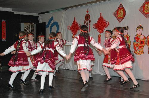 Bulgarian children perform traditional dancing at the art salon 'Two Cultures, One World' in Sofia, capital of Bulgaria, Feb. 11, 2010. 
