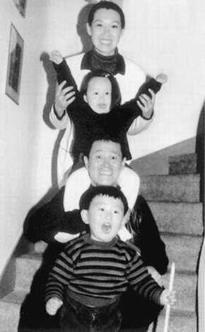Zhao Ben Shan with his wife and twins.