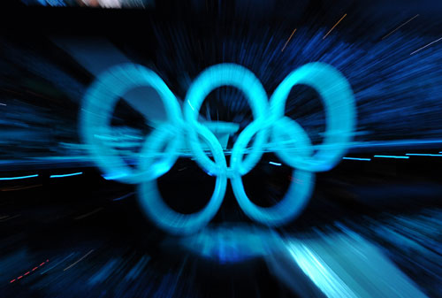 Photo taken on Feb. 12, 2010 shows the Olympic rings at the opening ceremony for the 2010 Winter Olympic Games inside the BC Place stadium in Vancouver, Canada. [Wu Wei/Xinhua]