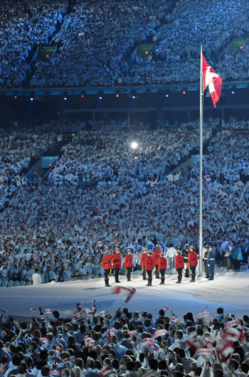 Flagbearers hold the national flag of Canada during the opening ceremony for the 2010 Winter Olympic Games inside the BC Place stadium in Vancouver, Canada on Feb. 12, 2010. [Qi Heng/Xinhua]