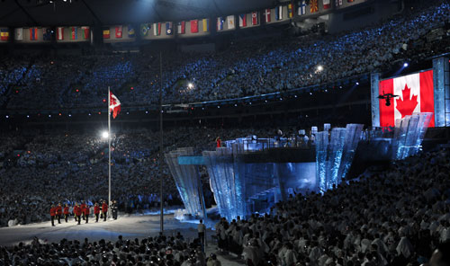 The national flag of Canada is raised during the opening ceremony for the 2010 Winter Olympic Games inside the BC Place stadium in Vancouver, Canada, on Feb. 12, 2010. [Qi Heng/Xinhua]