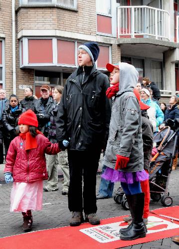 People watch performances during a celebration for the Chinese Spring Festival, or lunar New Year, in the Hague of the Netherlands, on Feb. 13, 2010. (Xinhua/Wang Xiaojun)