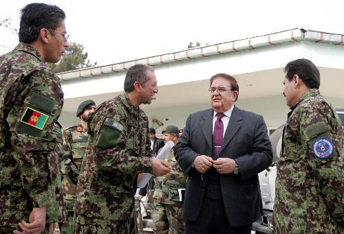 Afghan Minister of Defense Abdul Rahim Wardak (2nd R) speaks with officers regarding Helmand operation in Kabul, capital of Afghanistan, Feb. 13, 2010. Hours after launching major offensive by NATO and Afghan soldiers against Taliban militants in Marjah district of southern Helmand province, Afghan Minister of Defense Abdul Rahim Wardak said that several areas have been captured and clash for control of Marja Bazaar is going on.