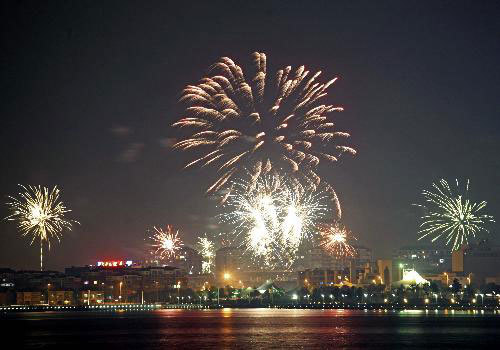 Photo taken on February 13, 2010 shows fireworks illuminating the sky over Yixing city, east China's Jiangsu Province. 