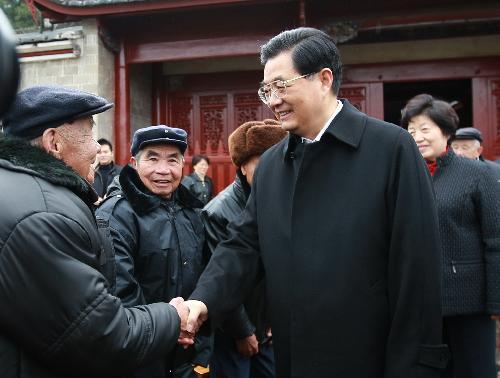 Chinese President Hu Jintao meets with veterans in Gutian Town of Shanghang County under Longyan City, southeast China's Fujian Province, February 13, 2010. 