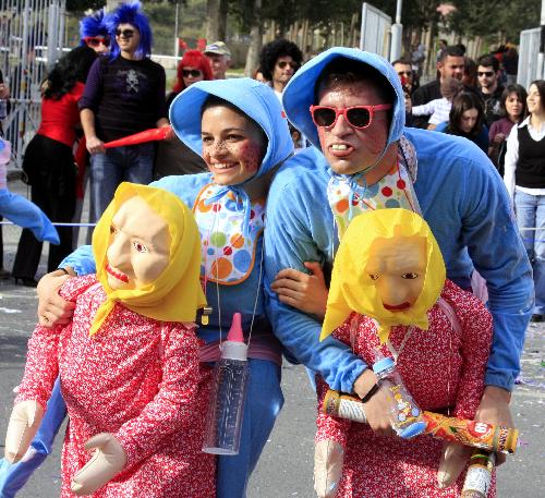 People attend a Grand Parade of the Limassol Carnival 2010 in the coastal city of Limassol, Cyprus, Feb. 14, 2010. 