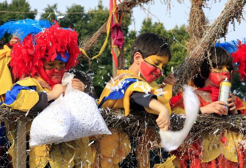 Children attend a Grand Parade of the Limassol Carnival 2010 in the coastal city of Limassol, Cyprus, Feb. 14, 2010. 