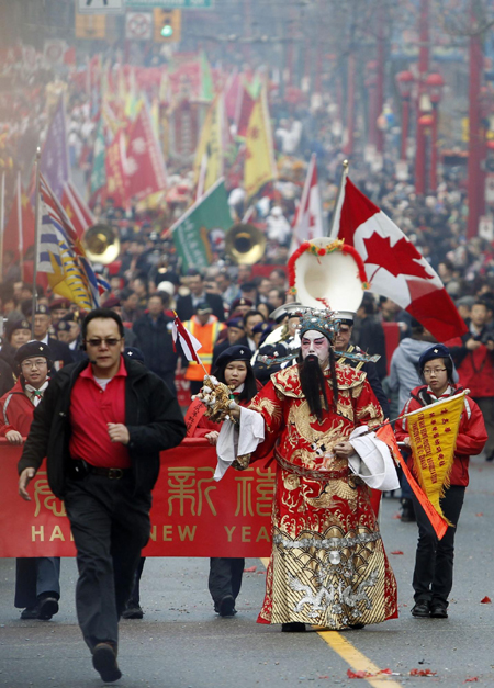 Participants take part in the annual Chinese New Year parade in Chinatown, during the Vancouver 2010 Winter Olympics February 14, 2010.