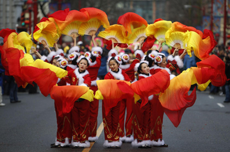 Dancers perform during the annual Chinese New Year parade in Chinatown in Vancouver February 14, 2010. The city is hosting the 2010 Winter Olympics. 