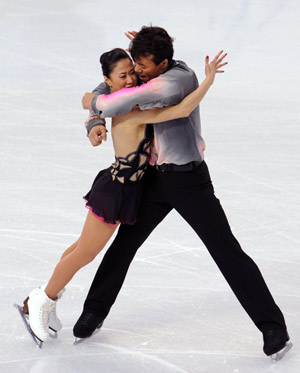 China's Shen Xue (L) /Zhao Hongbo perform in the pairs short program of figure skating at the 2010 Winter Olympic Games in Vancouver, Canada, on Feb. 14, 2010.