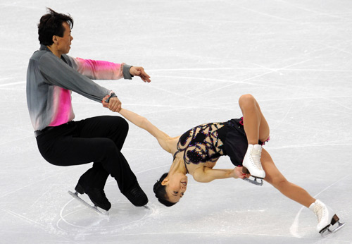 China's Shen Xue (R) /Zhao Hongbo perform in the pairs short program of figure skating at the 2010 Winter Olympic Games in Vancouver, Canada, on Feb. 14, 2010. 