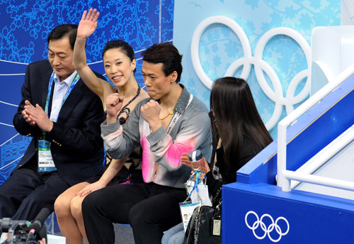 China's Shen Xue (2nd L) /Zhao Hongbo (2nd R) react after the pairs short program of figure skating at the 2010 Winter Olympic Games in Vancouver, Canada, on Feb. 14, 2010.