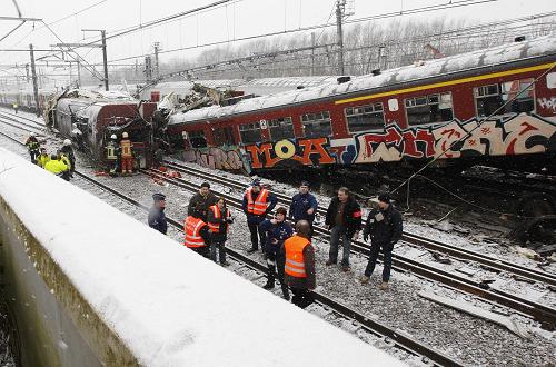 Emergency crew work on the site where two trains crashed near Halle February 15, 2010.