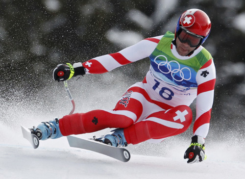 Switzerland's Didier Defago speeds down the course during the men's Alpine Skiing Downhill race of the Vancouver 2010 Winter Olympics in Whistler, British Columbia February 15, 2010.