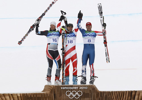  (L-R) Norway's silver medalist Aksel Lund Svindal, Switzerland's gold medalist Didier Defago and bronze medalist Bode Miller of the U.S. pose on the podium during the victory ceremony of the men's Alpine Skiing Downhill race of the Vancouver 2010 Winter Olympics in Whistler, British Columbia February 15, 2010.