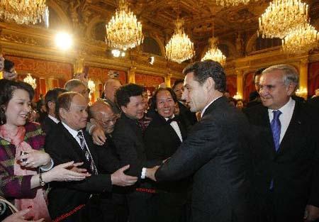 France&apos;s President Nicolas Sarkozy (2nd R) and Prime Minister Francois Fillon (1st R) shake hands with delegates at a ceremony celebrating the Chinese New year, the year of Tiger, at the Elysee Palace in Paris, capital of France, Feb. 16, 2010. (Xinhua/Zhang Yuwei)