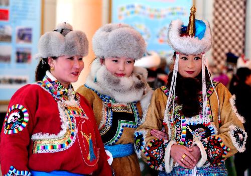 Participants pose during a show of Mongolian winter dresses in Dong Ujimqin Banner, Xilin Gol League, north China's Inner Mongolia Autonomous Region, on Feb. 16, 2010. Twenty teams from various parts of Inner Mongolia took part in the show on Tuesday. 
