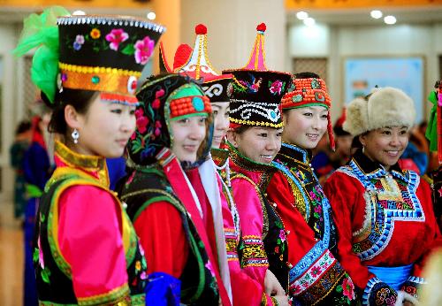 Participants pose during a show of Mongolian winter dresses in Dong Ujimqin Banner, Xilin Gol League, north China's Inner Mongolia Autonomous Region, on Feb. 16, 2010. Twenty teams from various parts of Inner Mongolia took part in the show on Tuesday. 