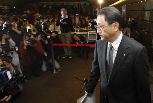 Toyota Motor Corp President Akio Toyoda arrives for a news conference in Tokyo February 17, 2010. Toyota said on Wednesday it would add a brake-override system, which cuts engine power when the accelerator and brake pedals are applied at the same time, to all future vehicles worldwide.