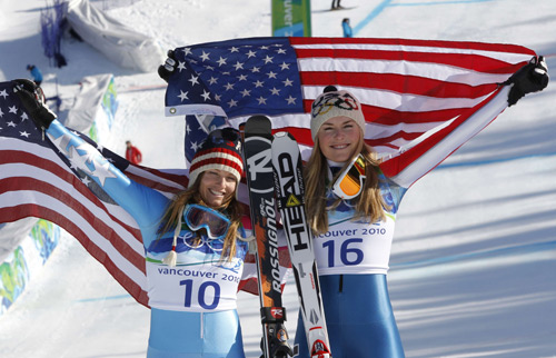 Lindsey Vonn (R) of the U.S. celebrates winning the gold medal together with country fellow and silver medalist Julia Mancuso following the women's Alpine Skiing Downhill race at the Vancouver 2010 Winter Olympics in Whistler, British Columbia, February 17, 2010.